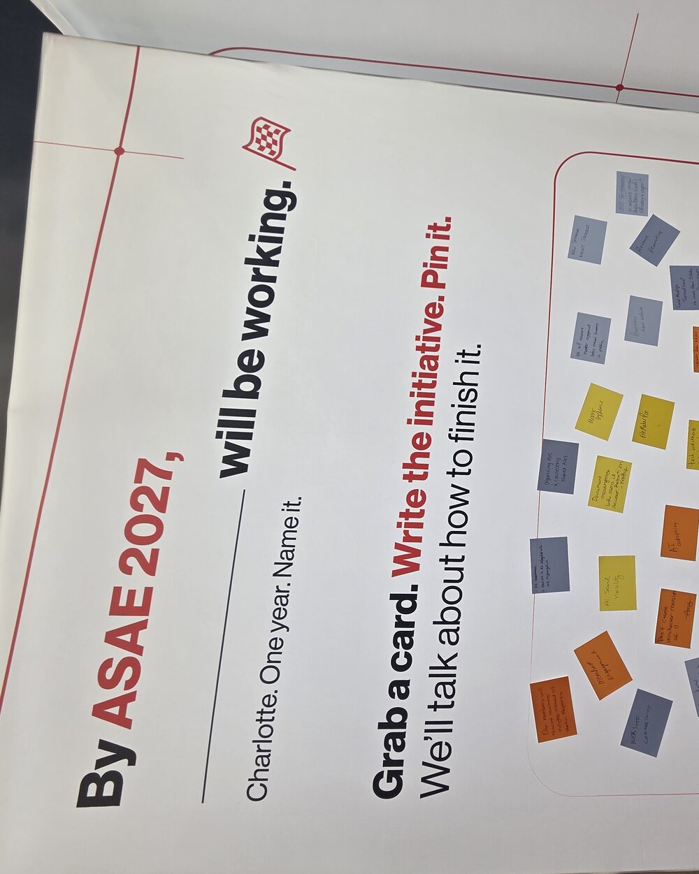 The filled 'By ASAE 2027, ___ will be working' initiative wall from our booth in Indianapolis